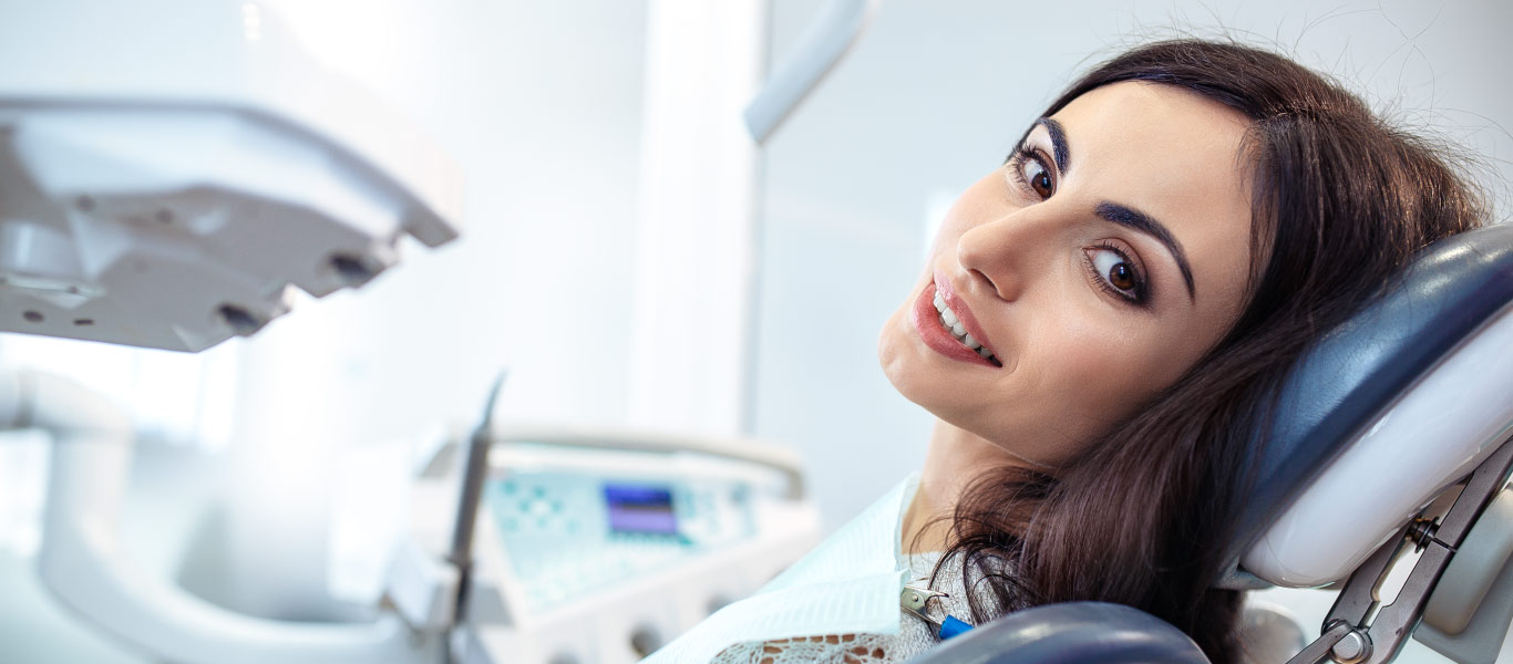 Dental patient looking back at camera smiling